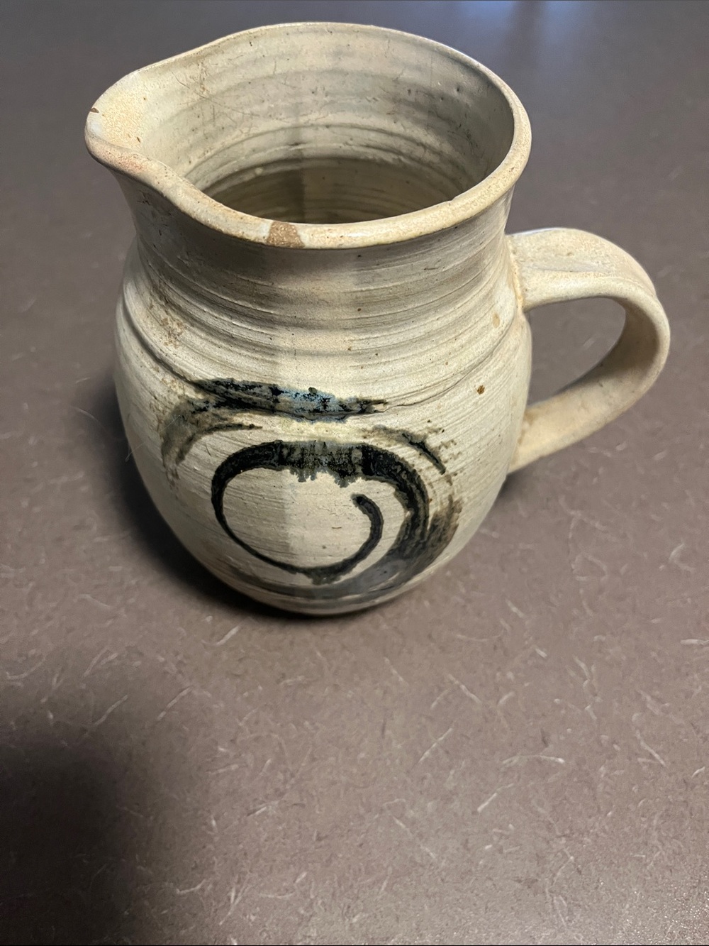 Handcrafted Cream Ceramic Pitcher with Black Brushstroke Accent 7” x 9”